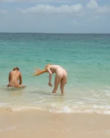 Nude beach girls Blue Angel and Jayme Langford are in bikinis to have lesbian fun