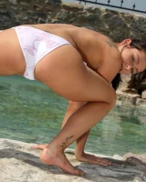 Puffy nipples Sonia Red in white bikini is by the pool