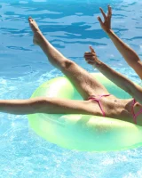 Asian chick Stefanie Moon is wearing pink stringkini getting sunburn by the pool