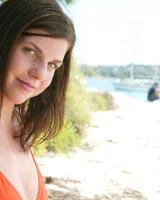 Young Bess in orange bikini and hidden hairy pussy in bikini on the beach