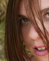 Young Bess in orange bikini and hidden hairy pussy in bikini on the beach