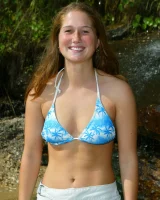 Bron takes off the skirt to appear in bikini and to be naked in the cold river to have her nipples puffy