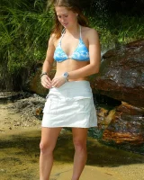 Bron takes off the skirt to appear in bikini and to be naked in the cold river to have her nipples puffy
