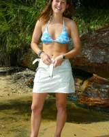 Bron takes off the skirt to appear in bikini and to be naked in the cold river to have her nipples puffy