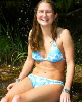 Bron takes off the skirt to appear in bikini and to be naked in the cold river to have her nipples puffy