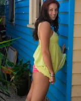 Tall hairy pussy Caitlin in pink bikini going nude at the house entrance