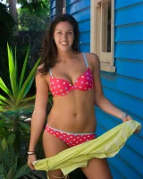 Tall hairy pussy Caitlin in pink bikini going nude at the house entrance