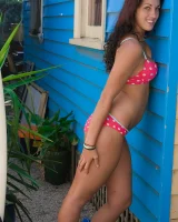 Tall hairy pussy Caitlin in pink bikini going nude at the house entrance