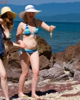 Big boobs lesbians Chloe and Sue Ann are on rocky beach in bikinis searching the hidden love place