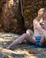 Big boobs lesbians Chloe and Sue Ann are on rocky beach in bikinis searching the hidden love place