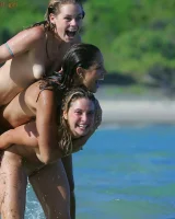 Lazuli, Seriya and Joan playing in the lake in bikinis