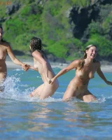 Lazuli, Seriya and Joan playing in the lake in bikinis