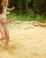 Hairy pussies Lizzie, Morgana and Collette playing on the beach in bikinis and nude in the water