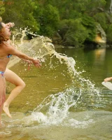 Hairy pussies Lizzie, Morgana and Collette playing on the beach in bikinis and nude in the water