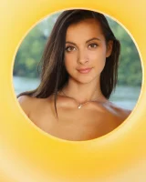 Young brunette Benita B shows her naked body and yummy pussy in an innertube