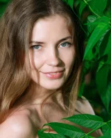 Sexy teen Celine in motley bikini in the forest with puffy nipples