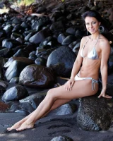 Stunning beach babe Melisa rolls naked in the sand flaunting her flawless body
