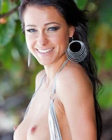 Stunning beach babe Melisa rolls naked in the sand flaunting her flawless body