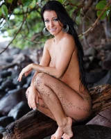 Stunning beach babe Melisa rolls naked in the sand flaunting her flawless body