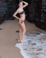 Puffy nipples brunette teen Sapphira in black bikini gets naked on hidden beach