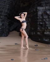 Puffy nipples brunette teen Sapphira in black bikini gets naked on hidden beach