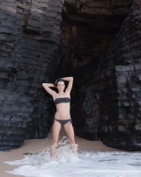 Puffy nipples brunette teen Sapphira in black bikini gets naked on hidden beach