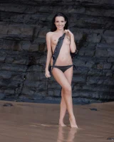 Puffy nipples brunette teen Sapphira in black bikini gets naked on hidden beach