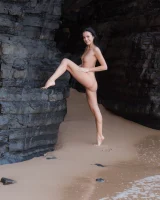 Puffy nipples brunette teen Sapphira in black bikini gets naked on hidden beach