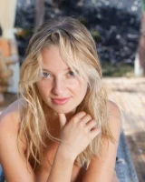 Sexy blonde Sarah showcases her shaved pussy after bikini removal on the patio