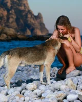 Long-haired beauty Sofiya removes a swimsuit for great nude seaside poses