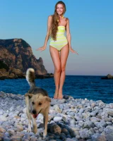 Long-haired beauty Sofiya removes a swimsuit for great nude seaside poses