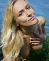 Blonde teen Vika P take off her bikini to pose nude in bushes by a lake