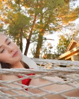 Sexy brunette Athena in red bikini