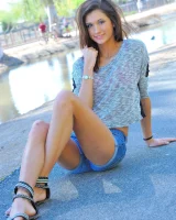 Slim sexy body Jody in tight jeans shorts and pink bikini is going fully nude outdoor at the canal