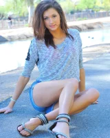 Slim sexy body Jody in tight jeans shorts and pink bikini is going fully nude outdoor at the canal