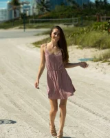 Delicious teen Mackenzie strips naked and poses shamelessly on the beach