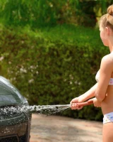 Sweet young teen Madison strips her bikini to wash the car & hoses her naked pussy
