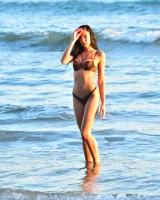 Brunette Marley is at the sea in tiger bikini walking topless with puffy nipples