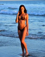 Brunette Marley is at the sea in tiger bikini walking topless with puffy nipples