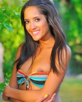 Michele is in the garden in motley bikini and nude