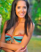 Michele is in the garden in motley bikini and nude