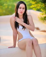 Hot babe Mikah strips off her swimsuit before shaving and toying her pussy