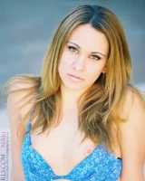 Glamour babe Nikki flashes her cameltoe in sexy lingerie by the pool