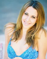 Glamour babe Nikki flashes her cameltoe in sexy lingerie by the pool