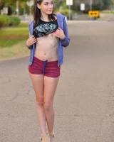 Skinny amateur teen Rachel slowly takes off her clothes and poses in public