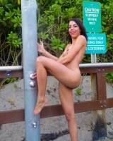 Amateur babe Rachel strips on the sandy beach & flaunts her small tits & pussy