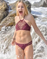 Athletic blonde babe enjoys pleasuring her bald pussy with sex toys