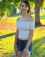 Long-legged amateur babe Tristan poses, strips and masturbates outdoors