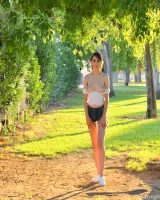 Long-legged amateur babe Tristan poses, strips and masturbates outdoors