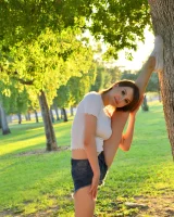 Long-legged amateur babe Tristan poses, strips and masturbates outdoors